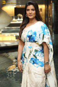 actress Aishwarya Rajesh cute in a white and blue dress