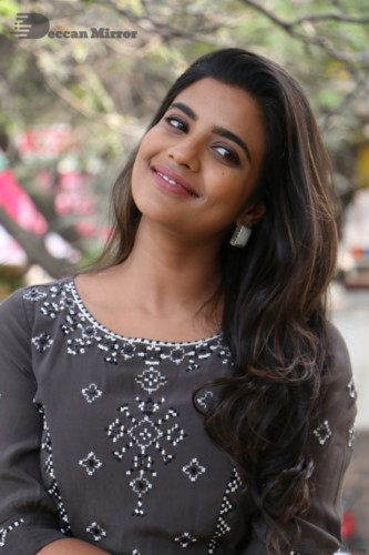 Heroine Aishwarya Rajesh poses for pictures in a brown dress