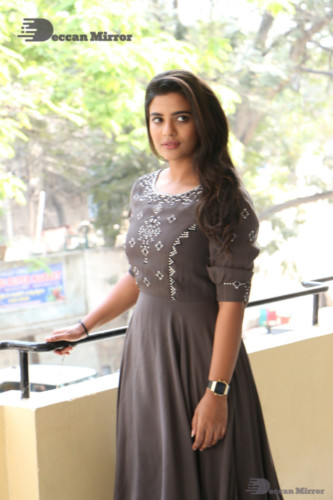 Heroine Aishwarya Rajesh poses for pictures in a brown dress