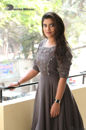 Heroine Aishwarya Rajesh poses for pictures in a brown dress