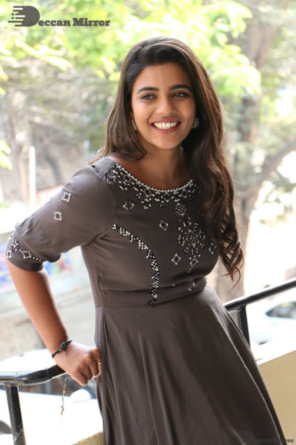 Heroine Aishwarya Rajesh poses for pictures in a brown dress