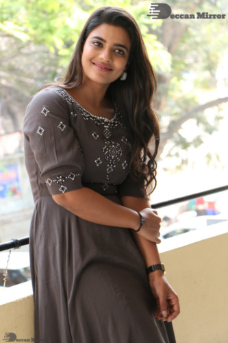 Heroine Aishwarya Rajesh poses for pictures in a brown dress