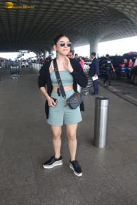 actress Alaya F in a green dress at mumbai airport