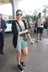 actress Alaya F in a green dress at mumbai airport