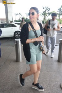 actress Alaya F in a green dress at mumbai airport