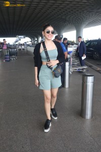 actress Alaya F in a green dress at mumbai airport