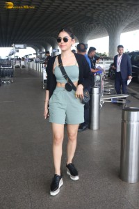 actress Alaya F in a green dress at mumbai airport