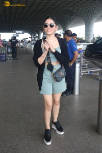 actress Alaya F in a green dress at mumbai airport