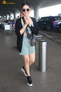 actress Alaya F in a green dress at mumbai airport