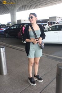actress Alaya F in a green dress at mumbai airport