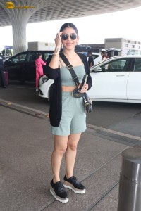 actress Alaya F in a green dress at mumbai airport