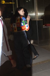 alia bhatt in a colorful sweater at airport