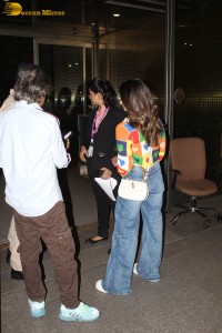 alia bhatt in a colorful sweater at airport