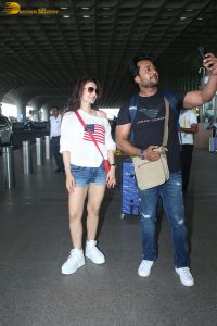 actress ameesha patel cute in a white top and blue denim shorts