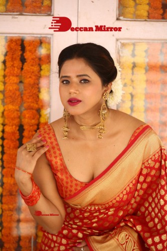 Telugu Heroine Amrita Halder posing in a Red Saree