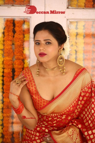 Telugu Heroine Amrita Halder posing in a Red Saree