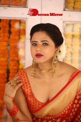 Telugu Heroine Amrita Halder posing in a Red Saree