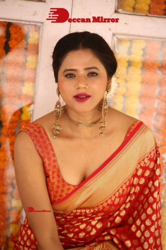 Telugu Heroine Amrita Halder posing in a Red Saree