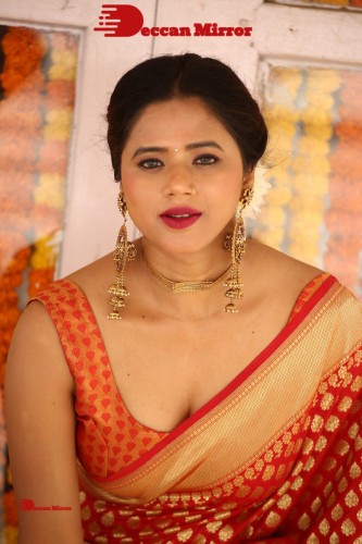 Telugu Heroine Amrita Halder posing in a Red Saree
