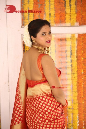 Telugu Heroine Amrita Halder posing in a Red Saree