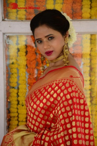 Telugu Heroine Amrita Halder posing in a Red Saree