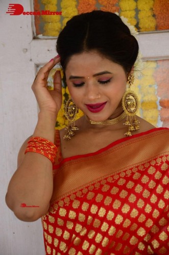 Telugu Heroine Amrita Halder posing in a Red Saree
