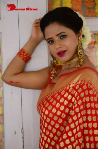 Telugu Heroine Amrita Halder posing in a Red Saree