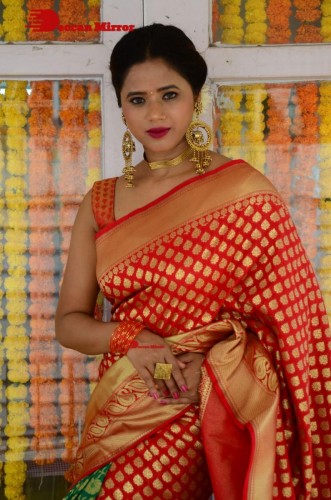 Telugu Heroine Amrita Halder posing in a Red Saree