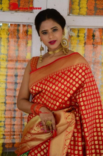 Telugu Heroine Amrita Halder posing in a Red Saree
