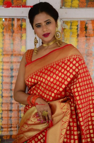 Telugu Heroine Amrita Halder posing in a Red Saree