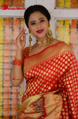 Telugu Heroine Amrita Halder posing in a Red Saree