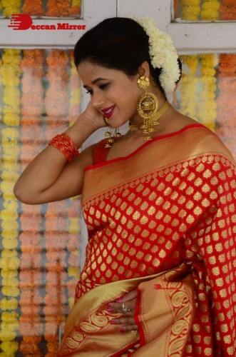 Telugu Heroine Amrita Halder posing in a Red Saree