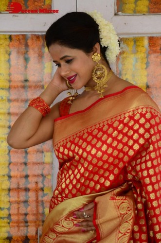 Telugu Heroine Amrita Halder posing in a Red Saree
