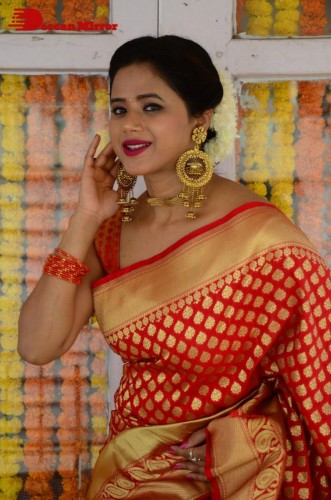 Telugu Heroine Amrita Halder posing in a Red Saree