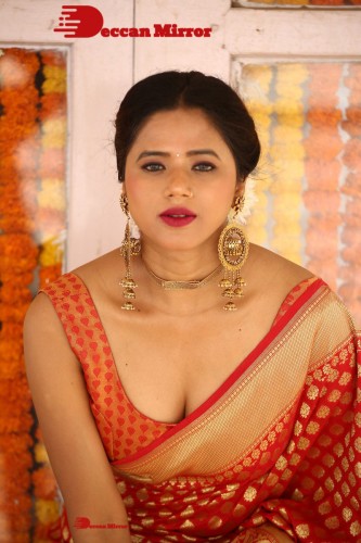 Telugu Heroine Amrita Halder posing in a Red Saree
