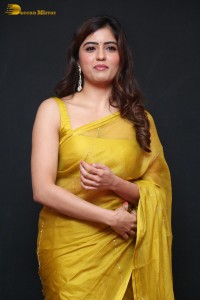 Actress Amritha Aiyer beautiful in a golden yellow saree