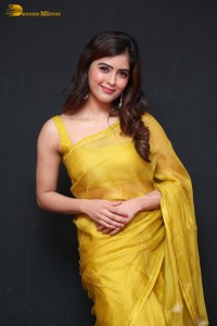 Actress Amritha Aiyer beautiful in a golden yellow saree