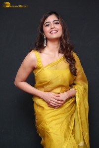 Actress Amritha Aiyer beautiful in a golden yellow saree