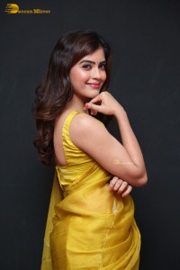 Actress Amritha Aiyer beautiful in a golden yellow saree