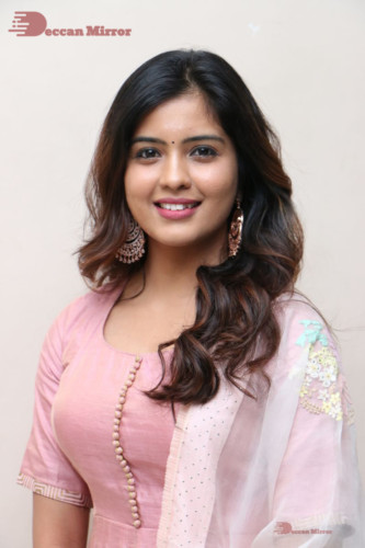 Actress Amritha Aiyer poses for a photoshoot in a pink salwar dress