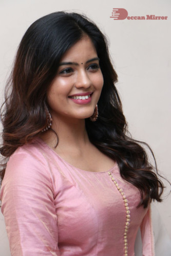 Actress Amritha Aiyer poses for a photoshoot in a pink salwar dress