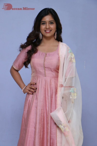 Actress Amritha Aiyer poses for a photoshoot in a pink salwar dress