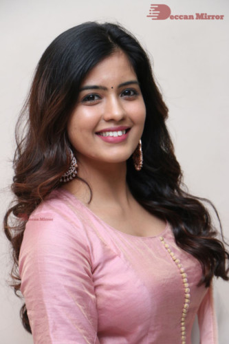 Actress Amritha Aiyer poses for a photoshoot in a pink salwar dress