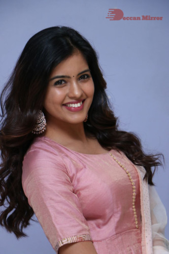 Actress Amritha Aiyer poses for a photoshoot in a pink salwar dress