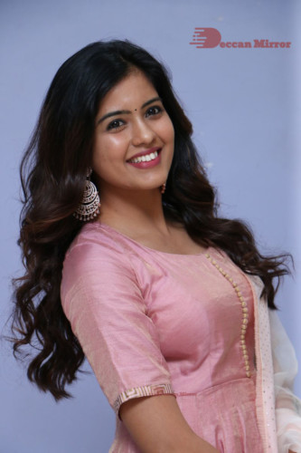 Actress Amritha Aiyer poses for a photoshoot in a pink salwar dress