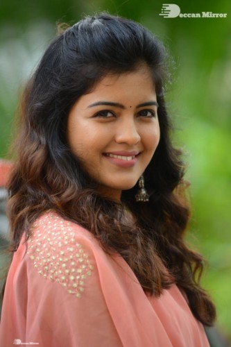 Telugu Actress Amritha Aiyer in a orange dress