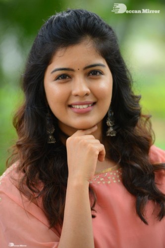 Telugu Actress Amritha Aiyer in a orange dress
