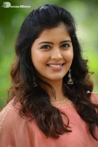 Telugu Actress Amritha Aiyer in a orange dress
