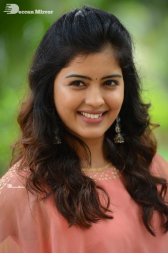 Telugu Actress Amritha Aiyer in a orange dress