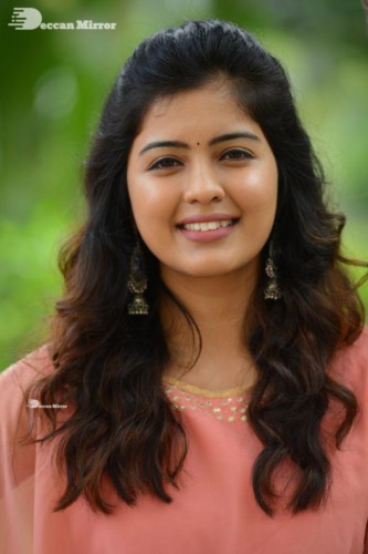 Telugu Actress Amritha Aiyer in a orange dress